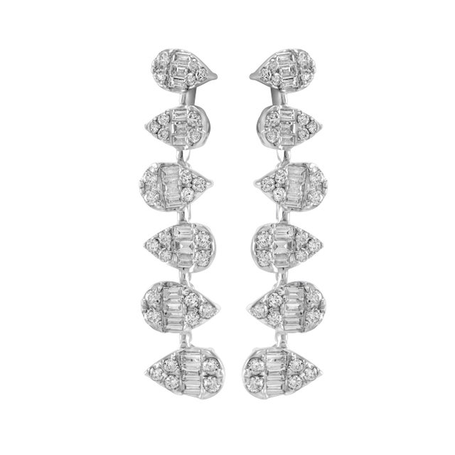 Sensational illusion set natural diamond earrings with the look of pear diamonds. 102 round and baguette cut diamonds,...