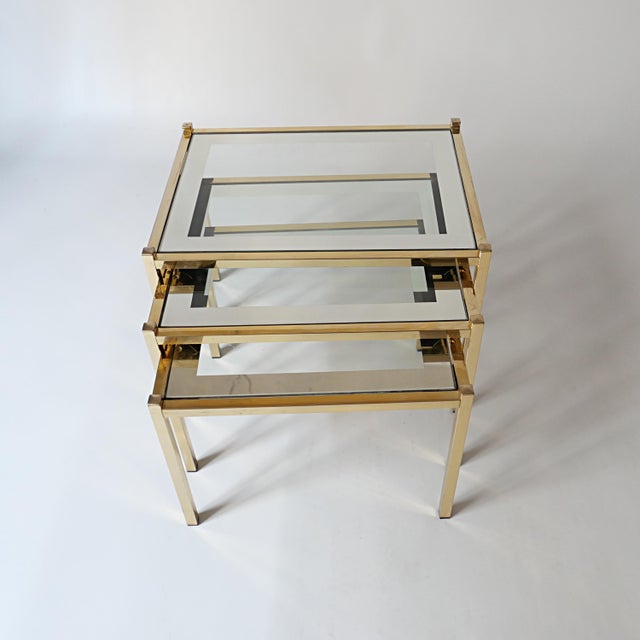 Vintage Nesting Coffee Tables in Gold-Tone Metal and Mirror, 1970s, Set of 3, in Good conditions. Designed 1970 to 1979
