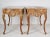 A playfull and flamboyant pair of painted and gilded, hand carved console tables, finished with a nicely done faux marble...