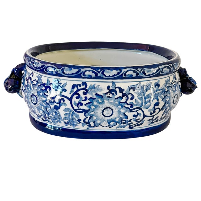 A large vintage blue and white Chinoiserie foot bath planter that will fit beautifully in your home whether you chose to...