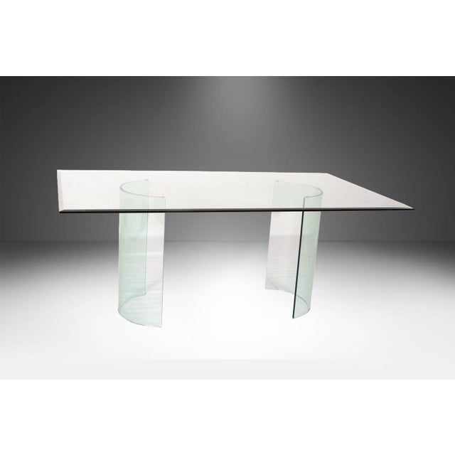 An exceptional and minimalist Postmodern all-glass dining table, heavily in the manner of premier Italian glass...