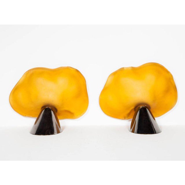 Pair of Art Nouveau Revival sconces. The sconces feature handblown Murano glass shades in amber hues with free-form water...