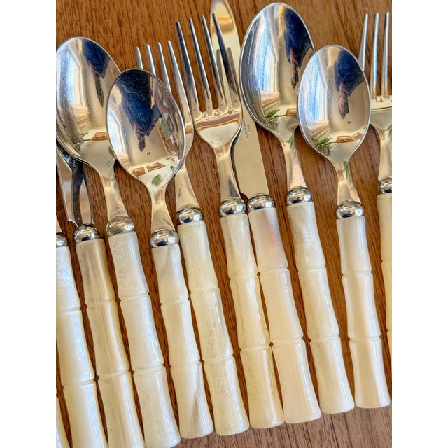 Beautiful Set of Mid Century style Italian Faux Mother of Pearl Bamboo handled 18/10 stainless flatware, by Inox. The...