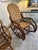 Great looking comfortable rattan rocking chair having double caned back and seat and handsome curlicue design. arm height...