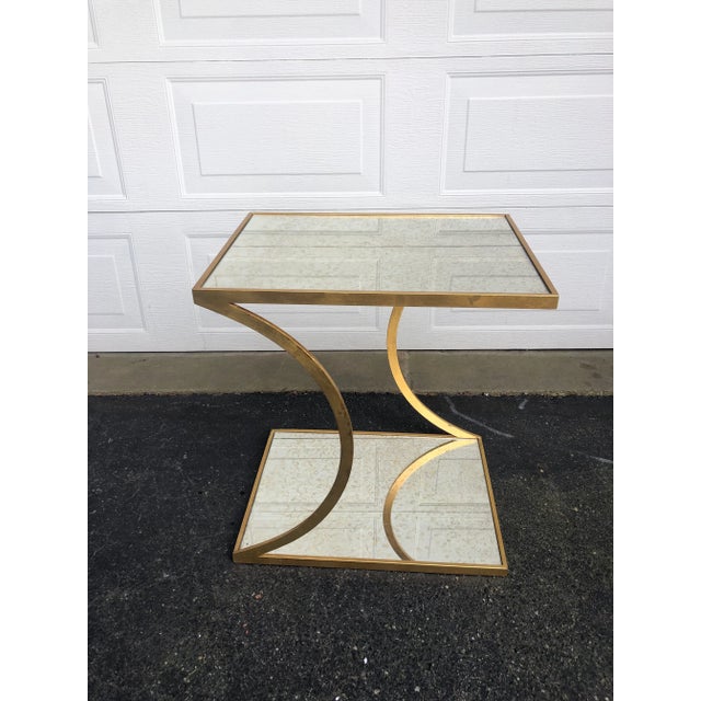 I have two fabulous heavy, heavy iron tables that have been gold gilded, with speckled mirror inserts .Believed to come...