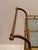 Elegant Regency style brass and glass, two handled and 3 tiered Italian mid century bar cart on casters. Space from middle...