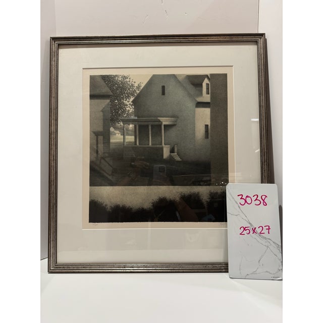 Atmospheric limited edition lithograph by American artist Robert Kipniss, depicting a quiet residential scene with closely...