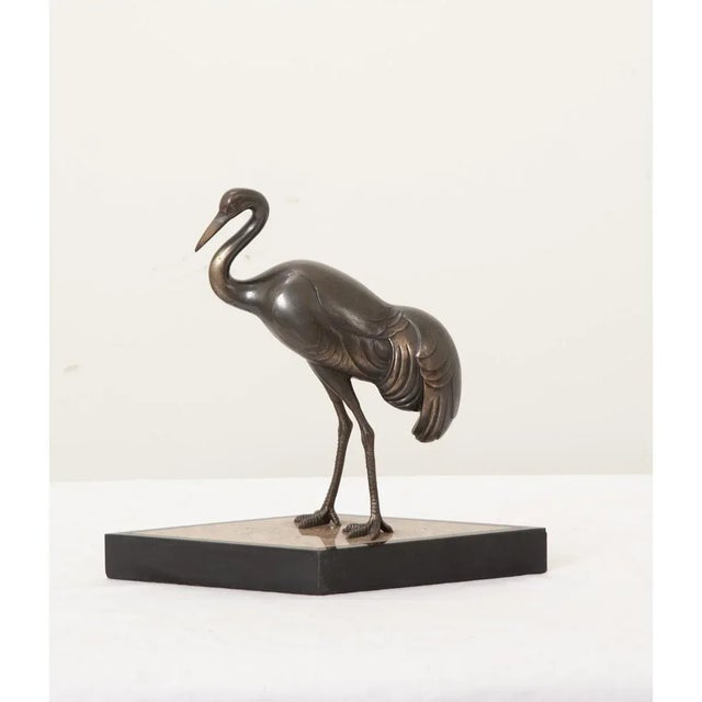 Dimensions: 12 ½” H x 13 ¾” W x 6” D French, early-to-mid 20th century petite statue of a stork, cast in bronze, mounted...