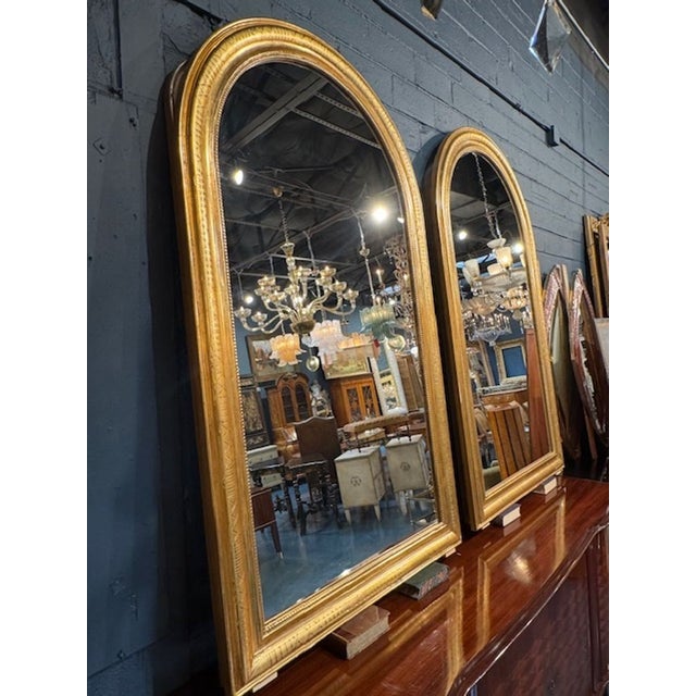 Beautiful pair of gold Louis Philippe Arch top mirrors with geometric pattern. These elegant mirrors would make a stylish...