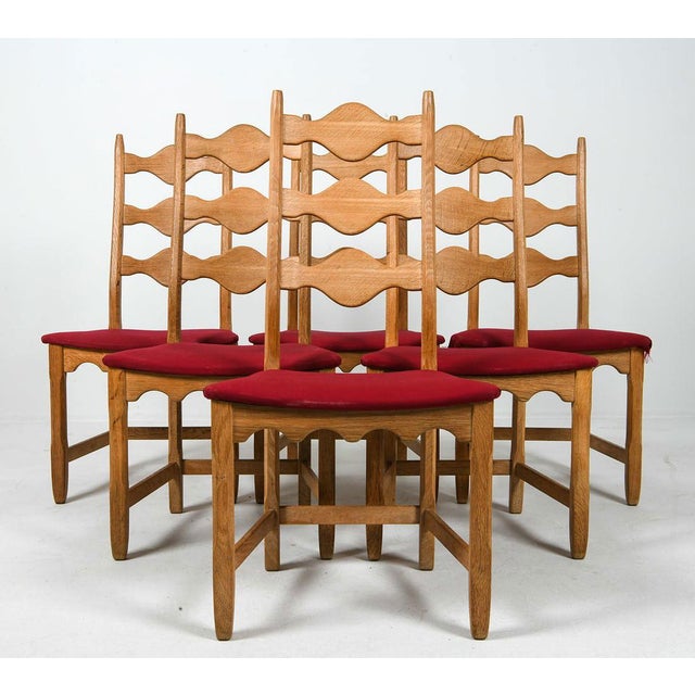 This impressive 10-piece mid-century dining set — comprised of two sets of oak chairs with identical razorback frames — is...