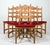 This impressive 10-piece mid-century dining set — comprised of two sets of oak chairs with identical razorback frames — is...