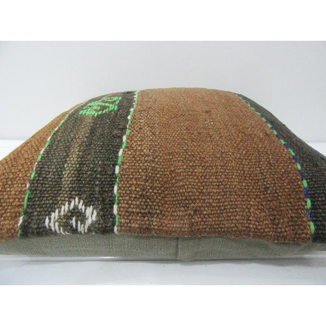 This is a pillow cover made from a vintage kilim rug. The piece was properly washed and ready to use. Pillow inserts not...