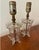 Sweet pair of petite table lamps made from antiqued glass. Details include etched florals and scalloped top. Pair these...