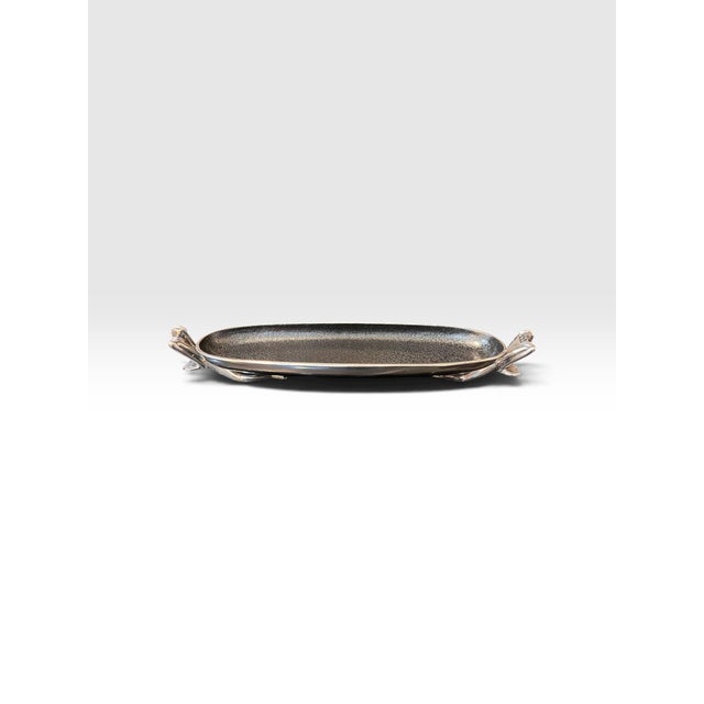 Striking Carrol Boyes “At Ease” small canoe bowl, made in South Africa. This distinctive sculptural serving dish features...