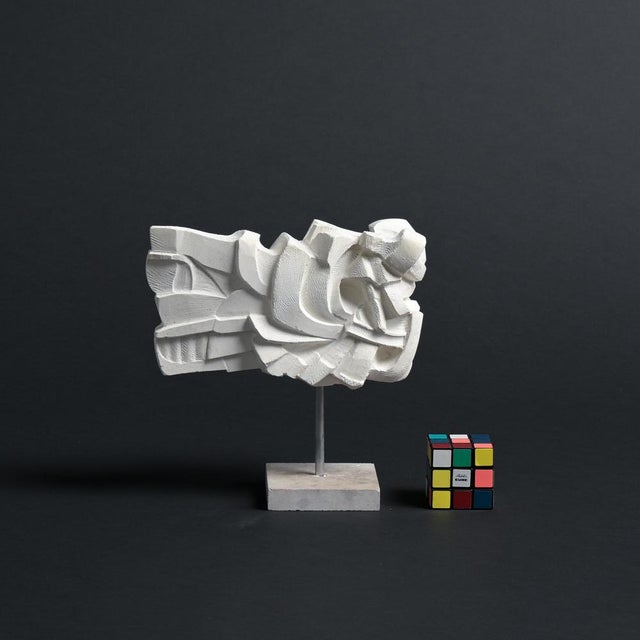 This abstract sculpture in plaster was made by the Belgian artist Jan Keustermans. The sculpture has a rough plaster...