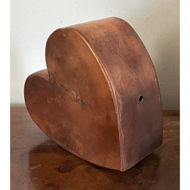 Folk art copper heart sculpture. Wonderful seamless construction with heavy gauge copper. Measures 6 1/2" x 6" across x 3...