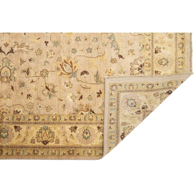 Modern Oushak Rug – Hand-knotted in soft wool, this elegant piece features a refined floral and vine design with a central...