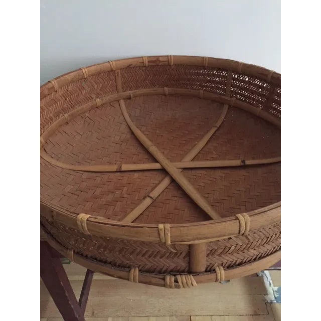 A large round well made basket from Kenya, great for decorative or practical uses.