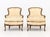 Pair of Louis XV Style Carved Wood Bergeres, white silk damask upholstery. 34" H x 29" W x 26" D; seat: 20" H. Provenance:...