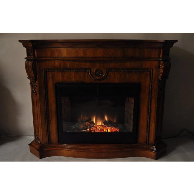 Twin Star International 62" Cherry Wood Empire Style Heater TV Stand Fireplace. Circa 21st Century, Pre-owned....