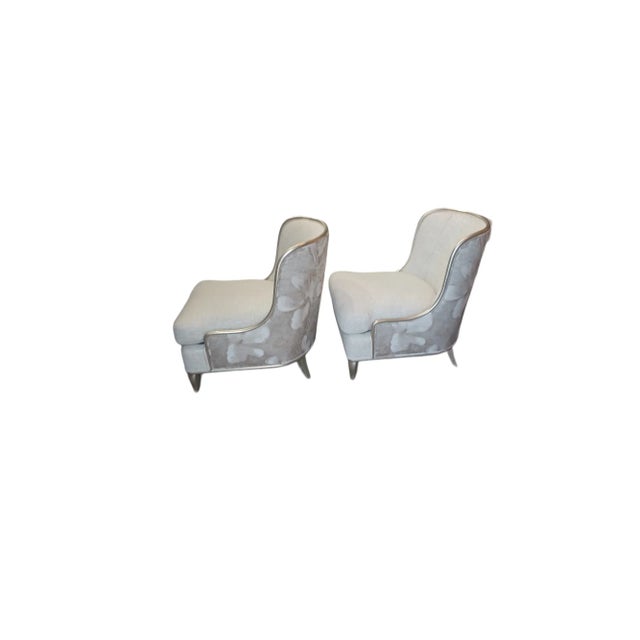 Exquisite Pair of Empress chairs by Barabara Barry for Baker. Chairs are gilt silver with a tole cream and metallic fabric...