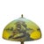 Arts & Crafts table lamp attributed to Phoenix, circa 1920, with a domed reverse-painted glass shade and an ornate,...