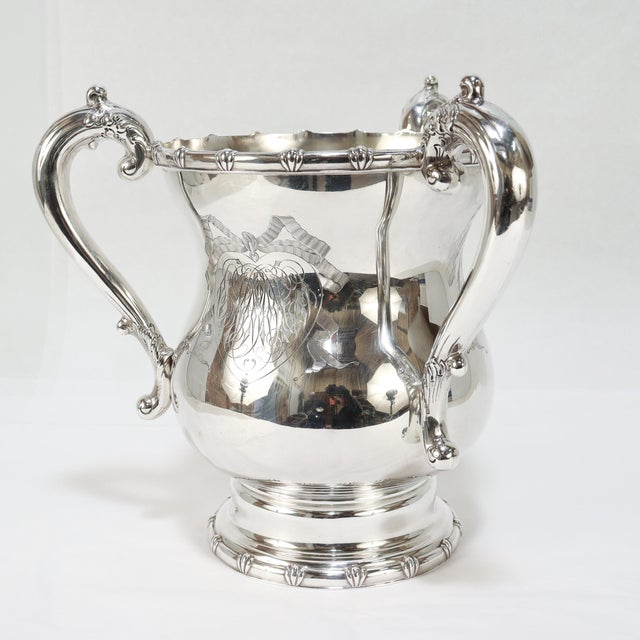 A fine antique, Edwardian era loving cup (or tyg). In sterling silver. By Howard & Co. - the early 20th century New York...