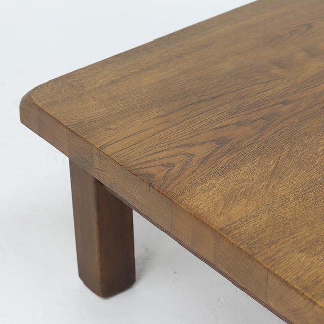 This small, square coffee table from the 1960s is crafted in the Brutalist style and made of heavy oak. The tabletop...