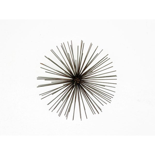 Vintage large sea urchin sunburst wire-metal wall sculpture. Year: 1970s Style: Mid Century Modern / Brutalist Dimensions:...