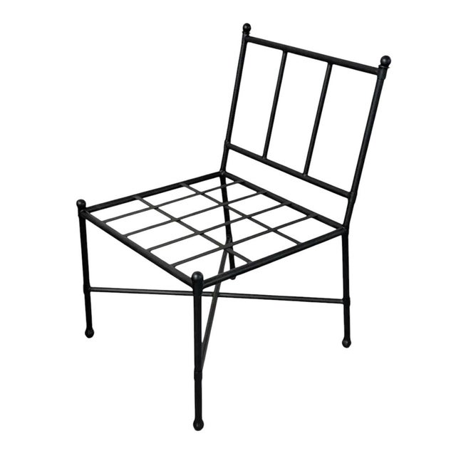 Elevate your outdoor living space with this sophisticated vintage iron lounge chair, featuring a timeless silhouette that...