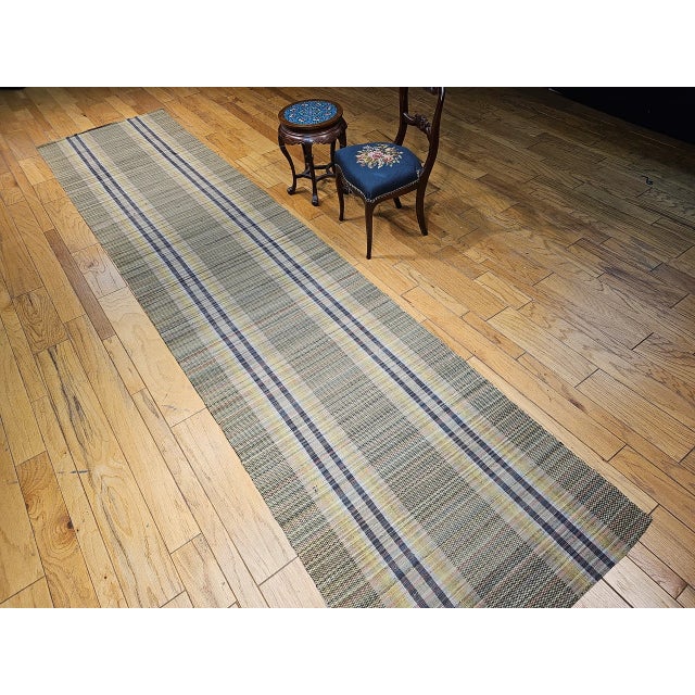 A charming and historically rich example of early American textile tradition, this Vintage American Amish Rag Runner dates...