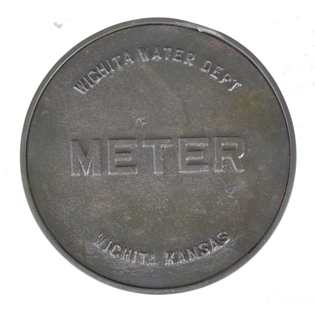 Reclaimed cast iron water meter cover stool with a steel frame. This would also make a great side table or plant stand....