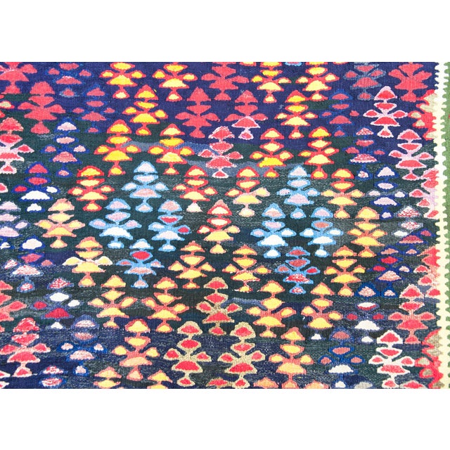 A wonderful vintage Persian Qazvin kilim rug with all-over multicolored trees-of-life woven in a pattern of criss-crossing...