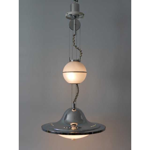 Gorgeous, extremely rare and highly decorative mid-century modern counterweight pendant lamp or hanging light 'ufo'....