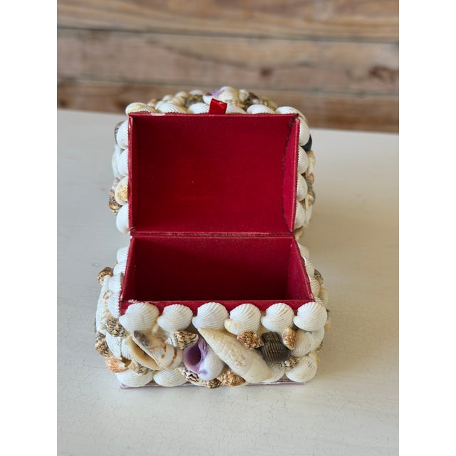 Charming pair of vintage shell encrusted trinket boxes featuring an abundant collage of natural seashells applied by hand....