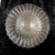 This is a large footed clear glass bowl with gold glitter in it. I do not know who made it, but I believe it is vintage...