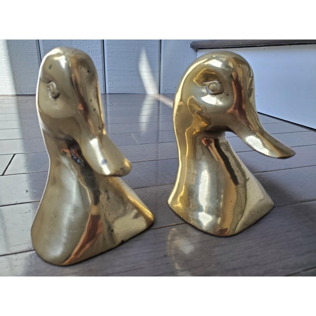 Pair of Mid Century brass duck bookends. Some vedrigris and patina from age but can be buffed out with brass polish. Fun...