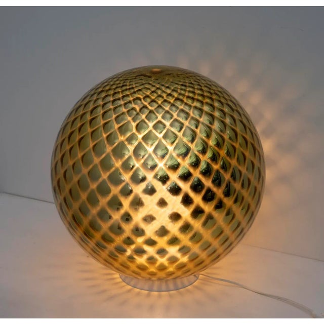 Original Murano glass table lamp, the peculiarity of this glass is the golden mirroring and blowing of the glass that...