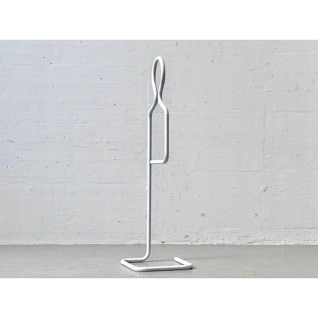 An exceptional vintage clothes rack, or valet stand, with a striking, sculptural design from the 1980s. The entire...