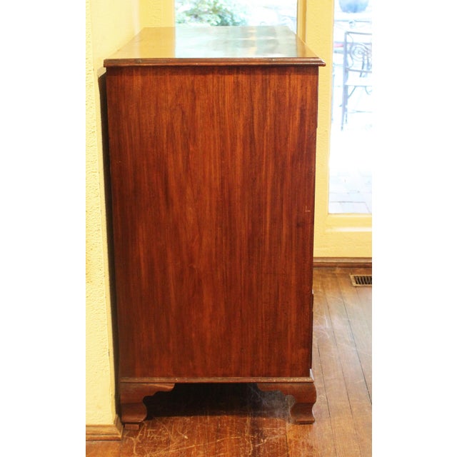 George III period, circa 1770, chest of drawers, English. 2 short over 3 long graduated drawers. Raised on restrained ogee...