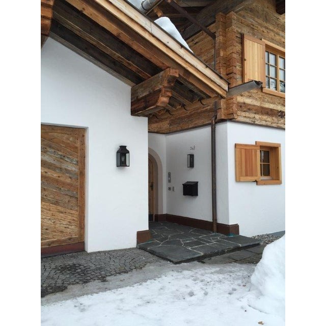 Wall light with pagoda structure in dark bronze and outside fitted clear or frosted glass. Spring closure. For indoor and...