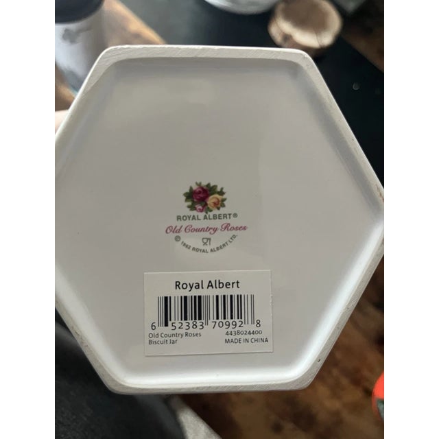A charming and elegant 8-inch biscuit jar from the iconic Royal Albert collection, featuring the beloved Old Country Roses...