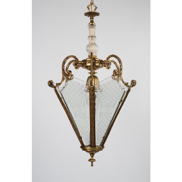 A vintage pendant light in the shape of a hexagonal ceiling iInverted pyramid lantern with a single light source. Made of...