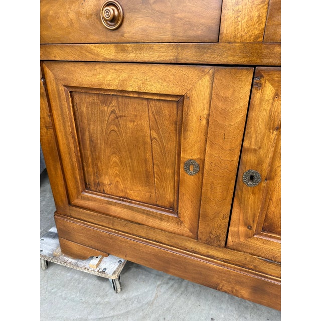 This is a beautiful 19th century French enfilade. Lovely patina, and simple wooden knobs and brass keyholes. The top has...