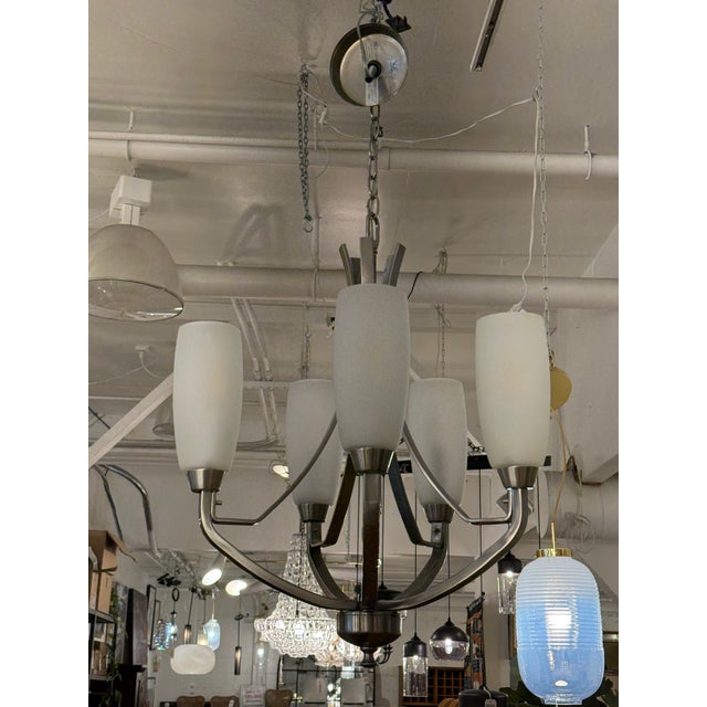 Design Plus Gallery presents a Wisten Five Light Chandelier by Progress Lighting. This five-light chandelier has a brushed...
