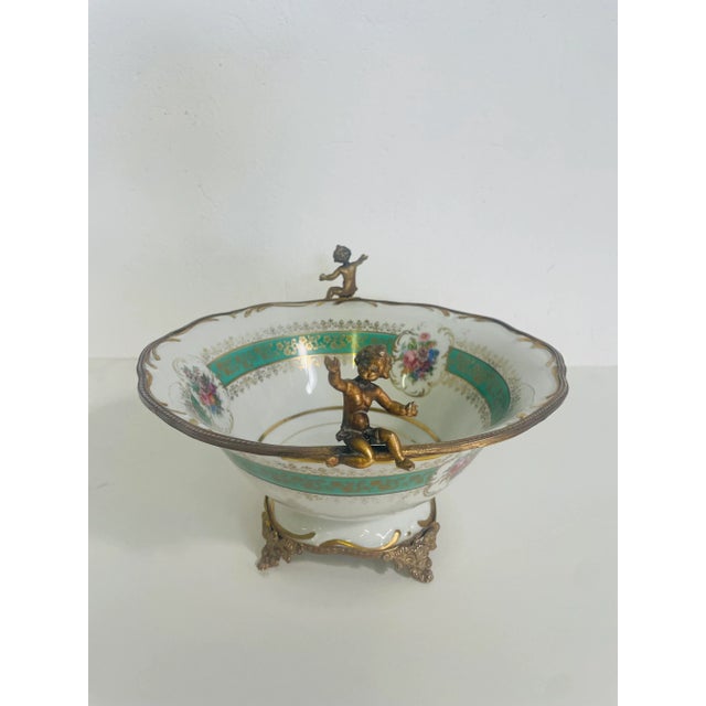 Centerpiece made in Limoges 1950s Classical French style Ceramic and bronze material Height 18 cm Diameter 30 cm This...