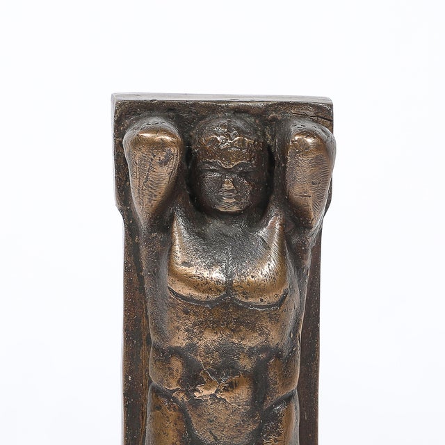 This striking Art Deco bronze sculpture, depicting a powerful Telamon figure, exemplifies the bold geometric and...