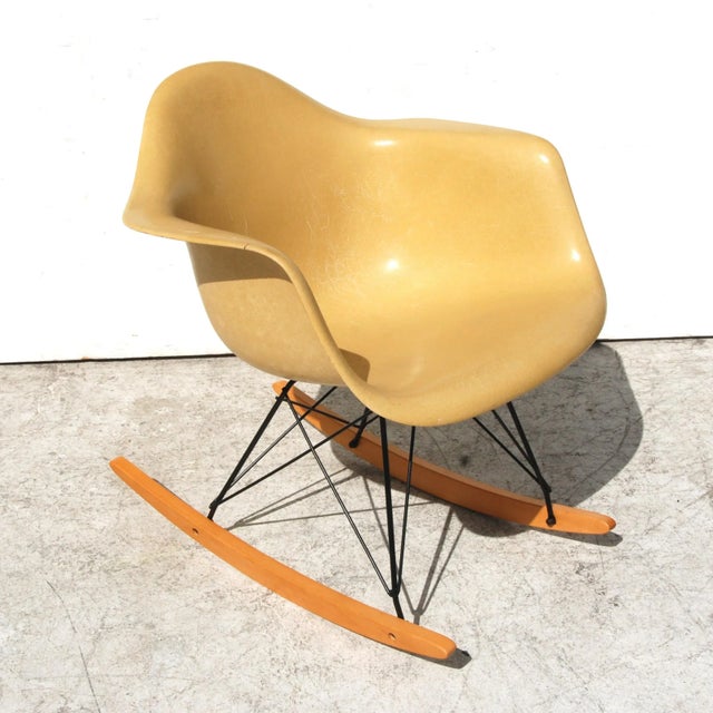 Herman Miller yellow armed shell fiberglass rocker designed by Eames Manufactured in the 1970s, this rocker is one of the...