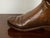 An English copper umbrella stand from the mid 20th century, depicting a boot. Created in England during the Midcentury...
