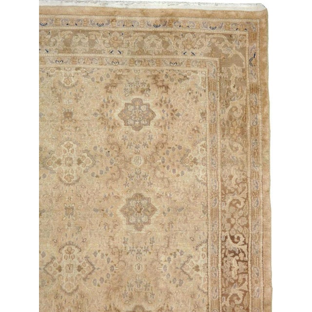 A vintage Indian Lahore accent rug handmade during the mid-20th century. Measures: 6' 10" x 9' 1".